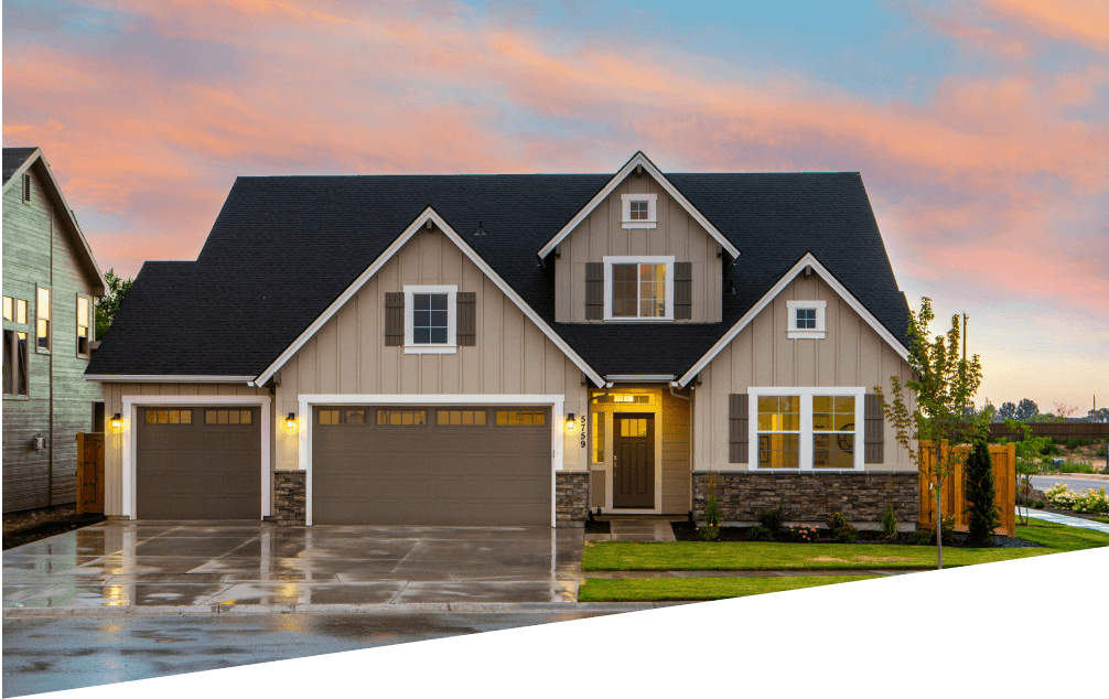 A house with a garage and driveway in front of it.